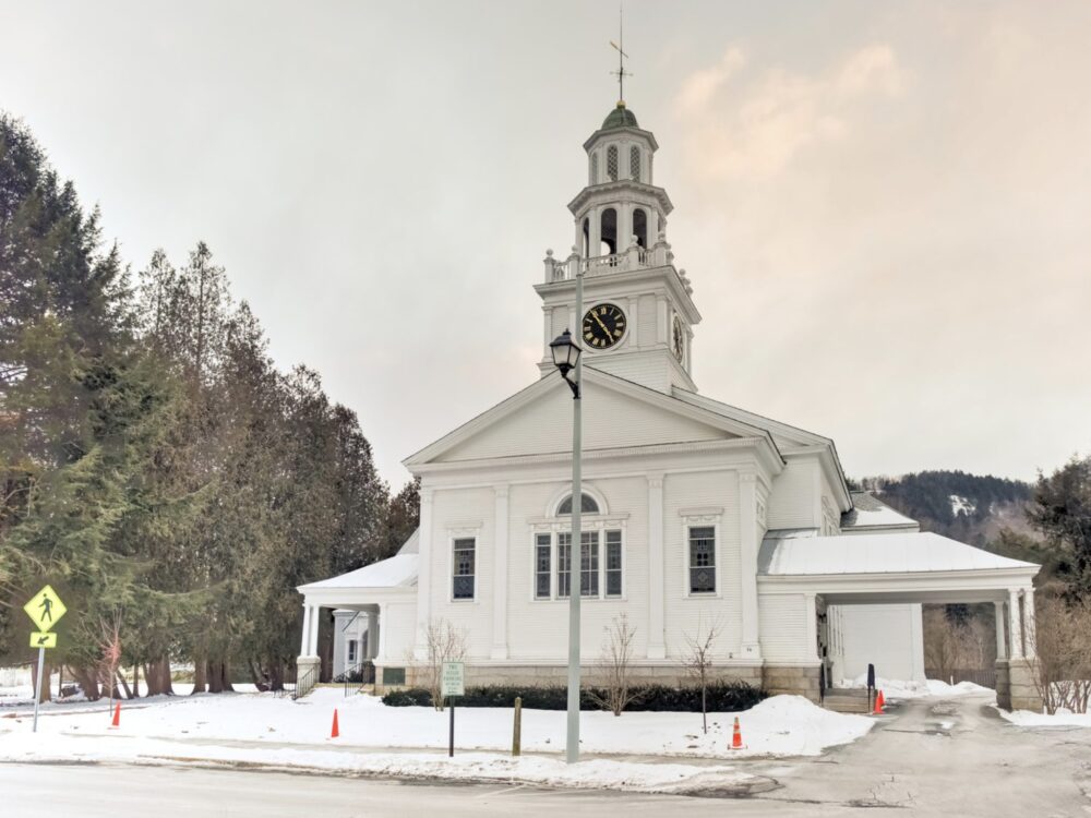 Slightly sunset colors and white church in Woodstock Vermont in the winter