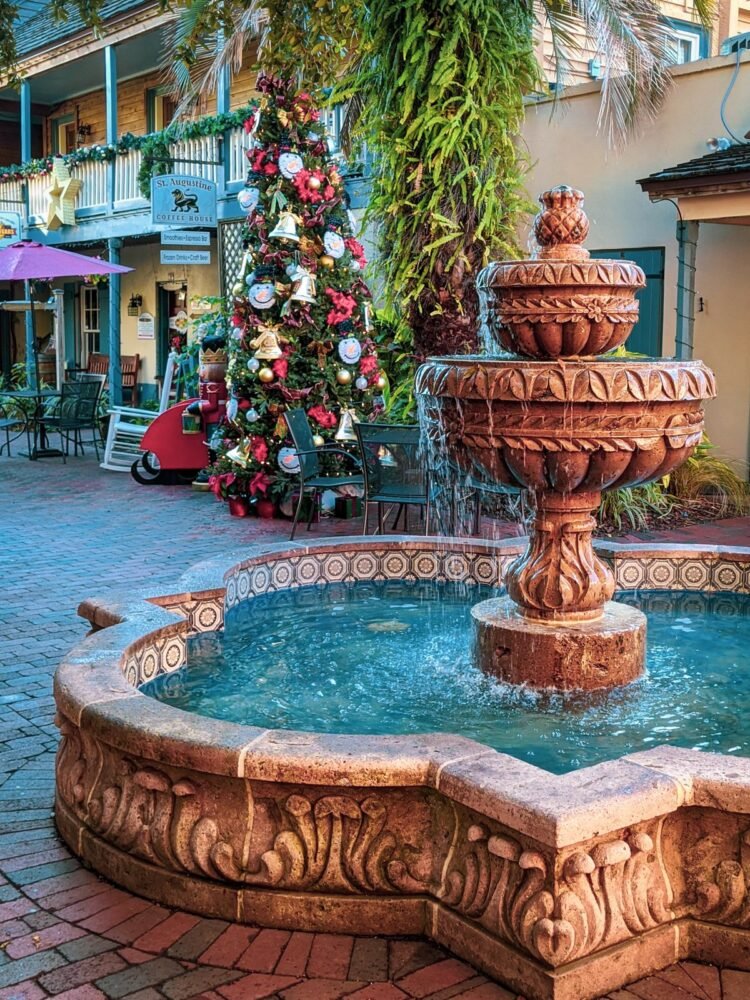 Water fountain with Christmas lights in background and Christmas tree in the holiday season in St Augustine