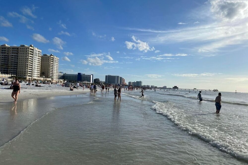 People enjoying the beach on a sunny day in Clearwater Florida a warm weather destination in the USA