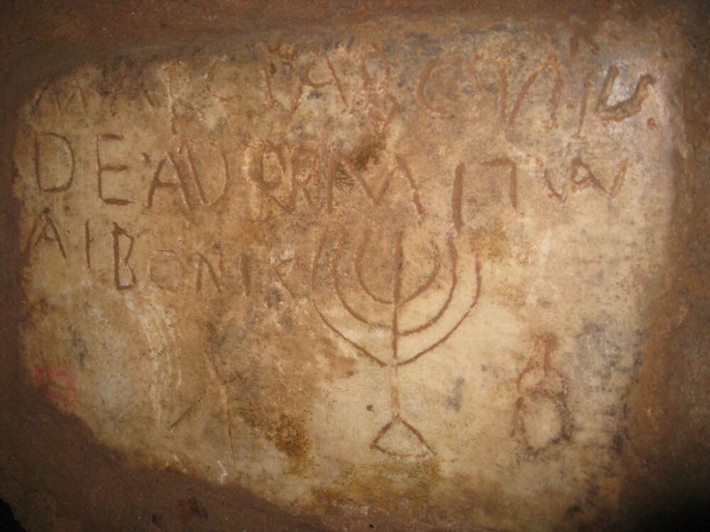 jewish catacombs with menorah inscription and letters