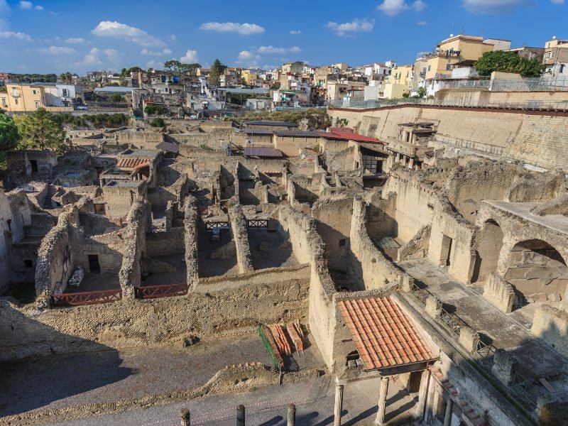 View of some of the ruins and remnants of the archaeological site of Herculaneum, seen from a vantage point above the ruins