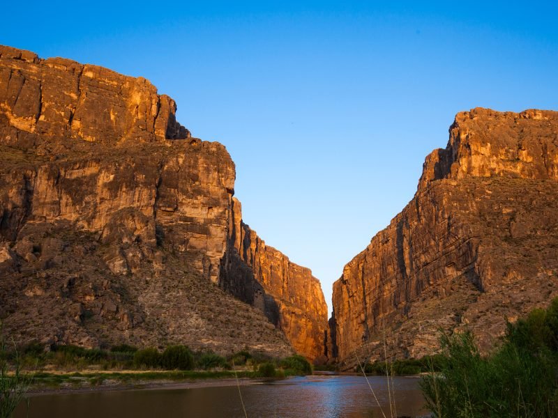 The Santa Elena Canyon in Big Bend National Park, with the Rio Grande in between the two sides of the canyon, in the late afternoon glow.