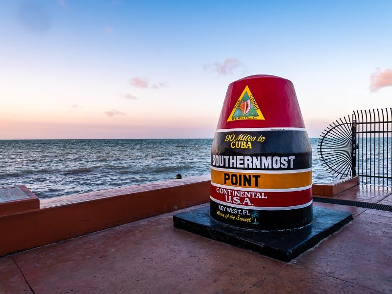 Famous point marking the southernmost point of the US and how far it is to Cuba, just 90 miles, at sunset.