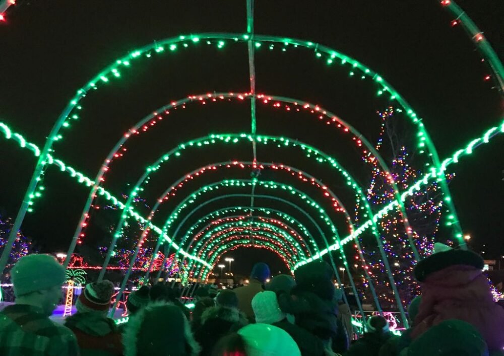A red and green christmas light tunnel at a light festival in minneapolis a great december destination in the usa for cold weather and festive fun