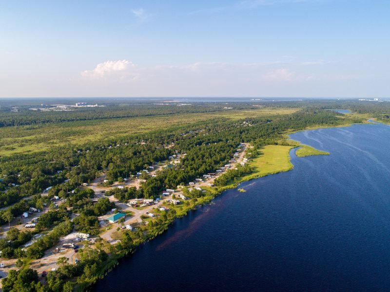 a warm weather january destination, the us gulf shores in alabama, with aerial view of the landscape and water