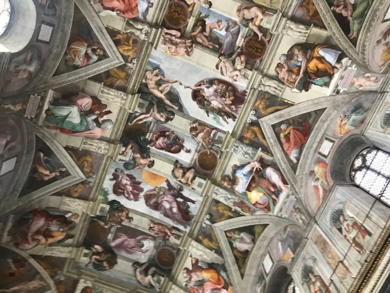 interior frescoes of the Sistine Chapel with beautiful fresco work done by Michelangelo