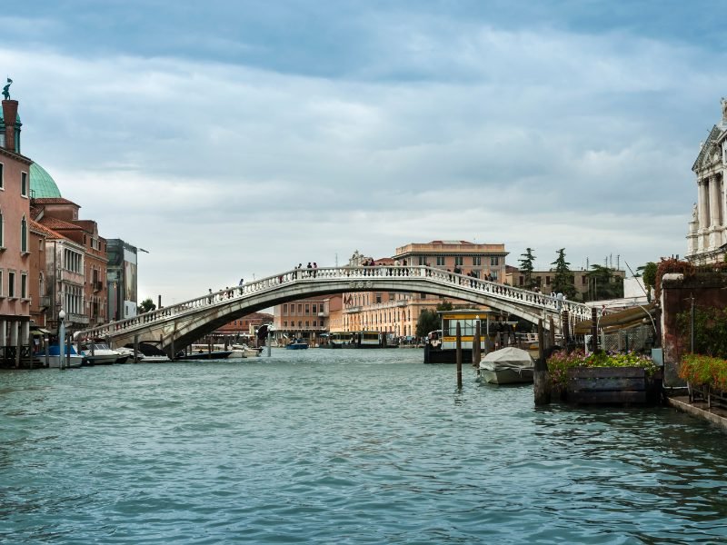 large bridge over the grand canal, on a partly cloudy day