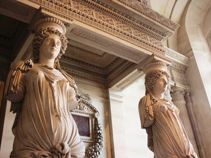 The famous Caryatids sculpture at the Louvre, where large human figures form pillars, that support a larger structure