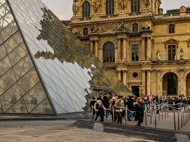 Large crowd in the winter of people waiting in line to get into the Louvre at the popular Pyramid entrance... there are other entrances that are less crowded!