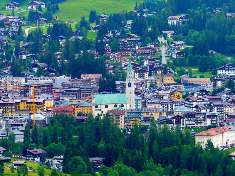 The town of Passo Tre Croci as seen from the road with trees