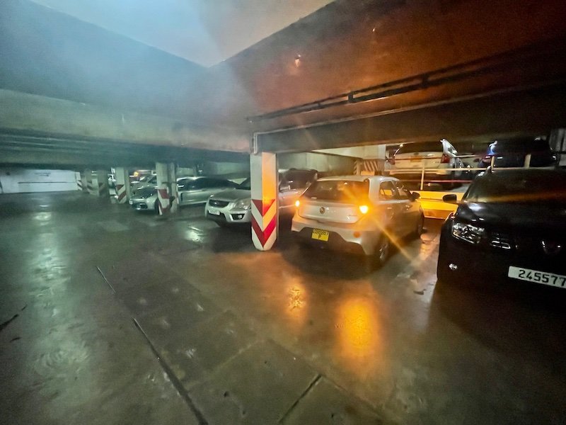 Car parking in a small parking lot in Tahiti