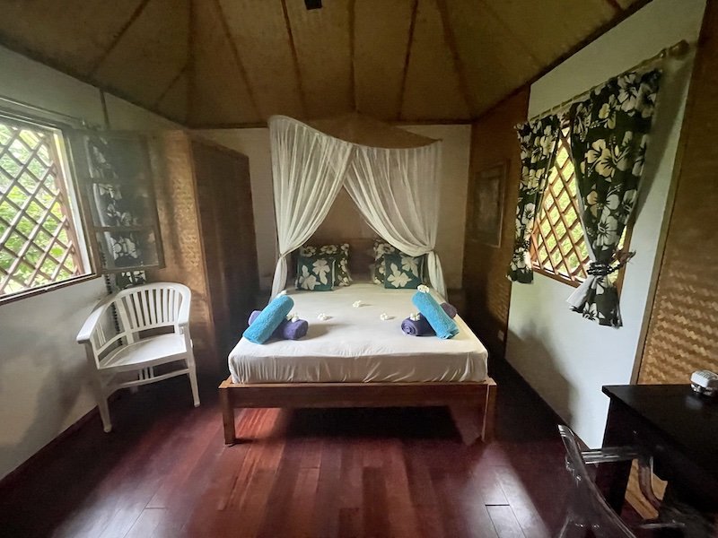 The interior of the Poerani Moorea guesthouse with canopy and furnishings