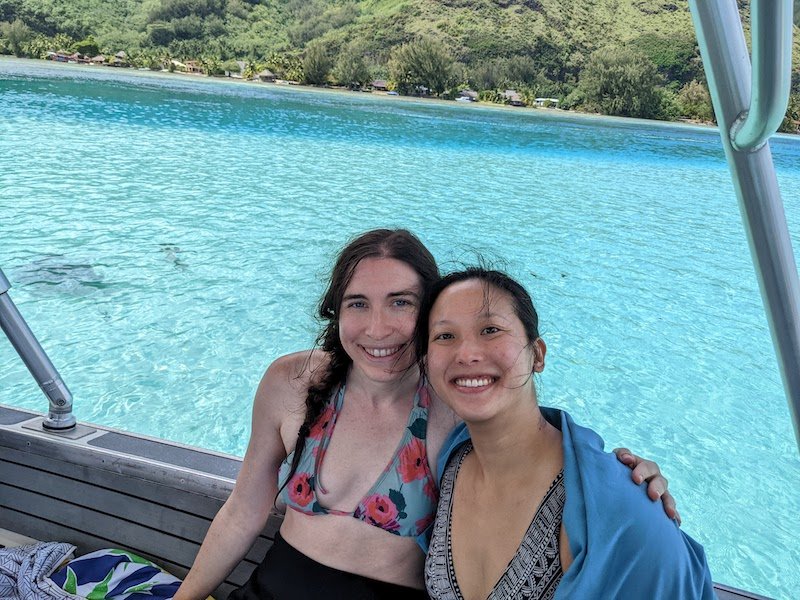 Allison and her partner enjoying a surface interval in a lagoon while diving in Moorea
