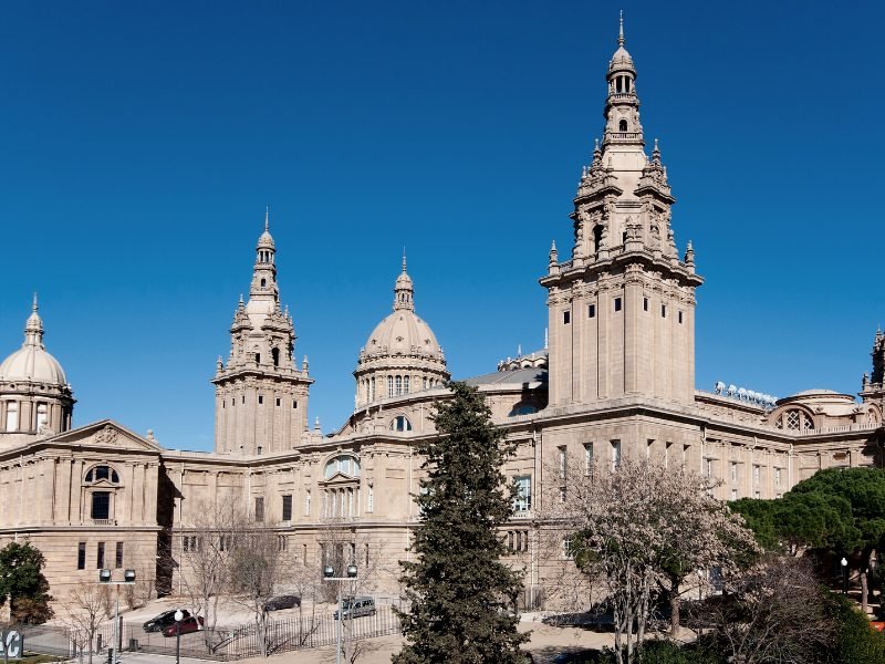 The enormously sprawling castle-like building that houses the national museum of catalan art in barcelona