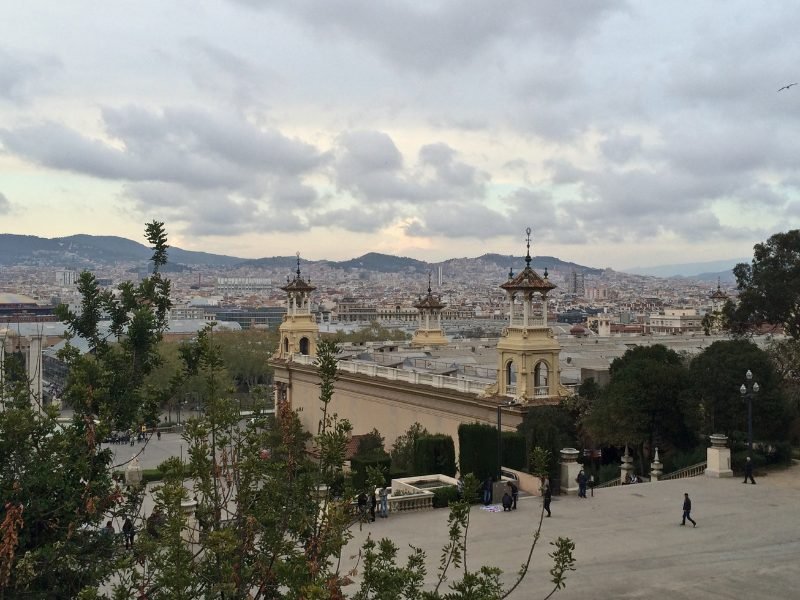 A cloudy winter day in Barcelona, with very few people on the street, and pretty skyline with clouds approaching sunset