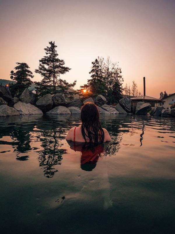 A woman in the water at Chena hot springs in Fairbanks Alaska enjoying the hot water on a cold winter day