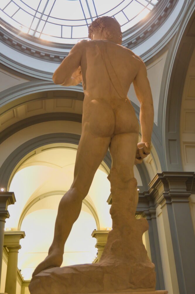 The backside of t he famous Statue of David artwork in the Accademia Gallery in Florence