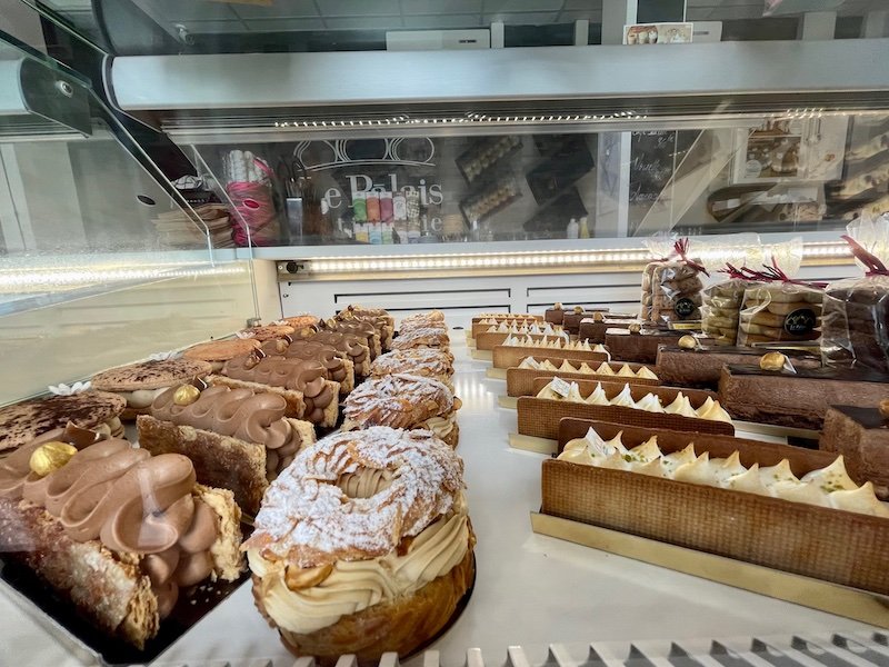 Different cream-filled French pastries in the case at a popular French bakery in Papeete Tahiti