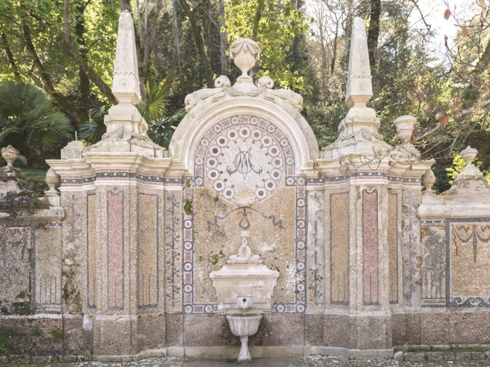 A beautiful ornate fountain with mosaic work in the gardens of Quinta da Regaleira, one of the most famous landmarks of Sintra