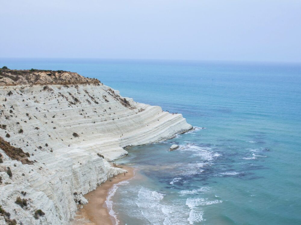 The gorgeous white stone 'stairs' with beach and clear waters leading out into the sea.