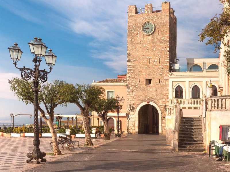 The famous clocktower of Piazza IX Aprile with a panorama spot where people can look out at a view