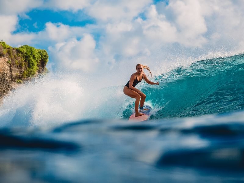 Woman on a surfboard in Tahiti