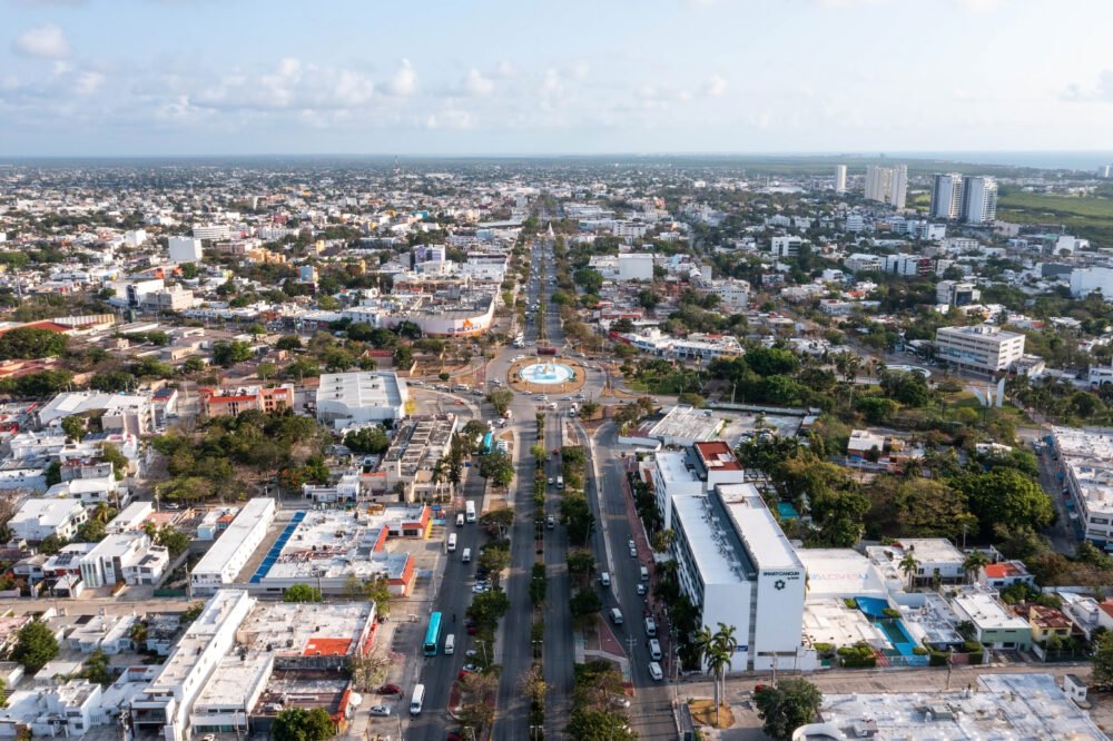 Aerial view over the city of Cancun with a big traffic circle and lots of cars