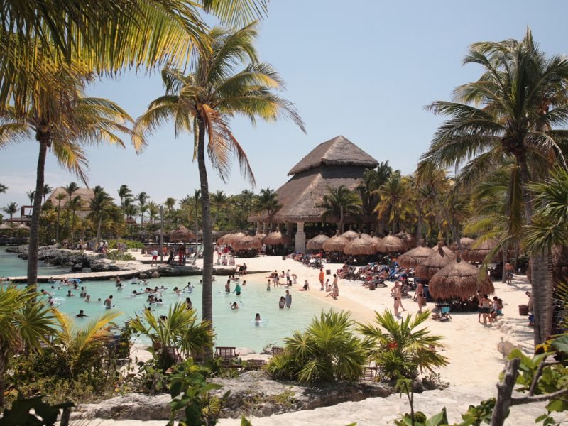 The waterpark at Xcaret on a busy day with lots of families and people enjoying the sunny weather