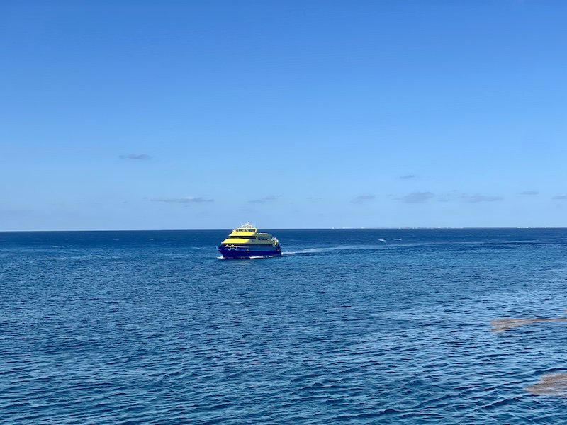 The yellow and blue UltraMar Cozumel ferry