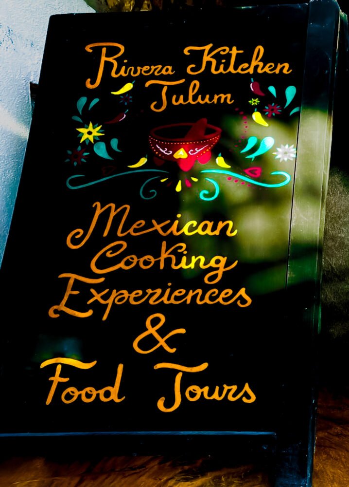 Rivera Kitchen food tour sign with yellow cursive font