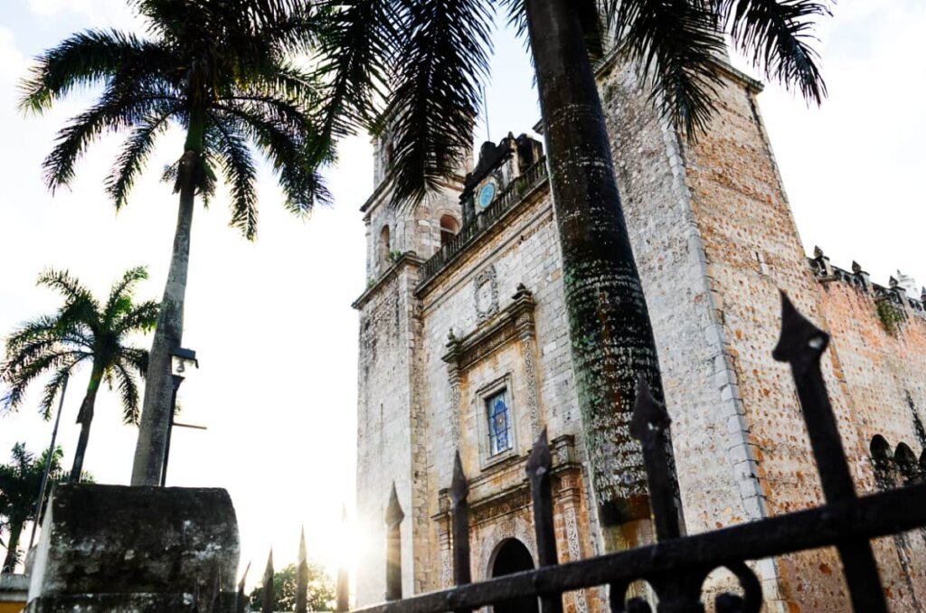 Church of Valladolid with palm trees in the background