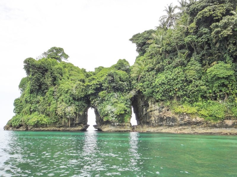 bird island in Panama with natural double archway  with lots of nature and foliage on the island