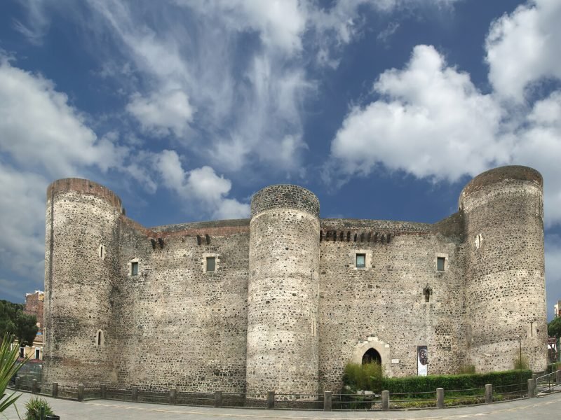 Castle Ursino with three pillars and lots of stonework, an ancient castle that used to be by the sea but is now inland.