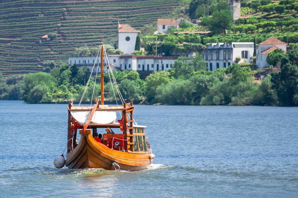 a traditional rabelo boat that is used to transport wine on the douro river