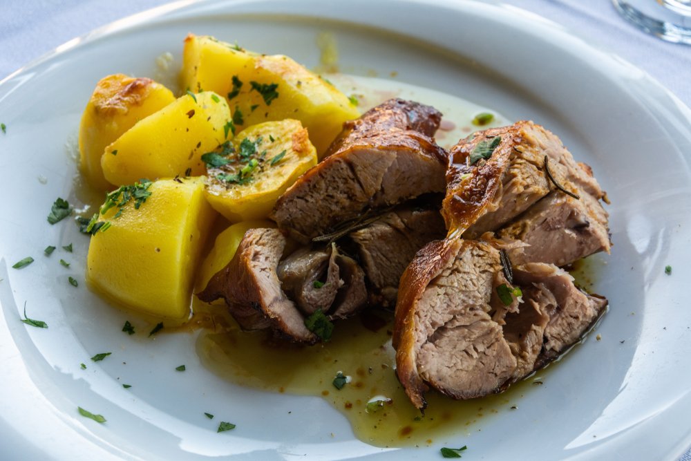 Delicious tender roasted lamb flavored with thyme and rosemary, served with potatoes at a Greek cooking class in Athens
