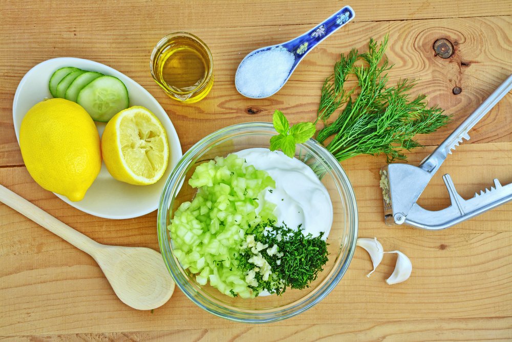 Learning to make tzatziki with yogurt, cucumber, lemon, dill, salt, oil, garlic at an Athens cooking class