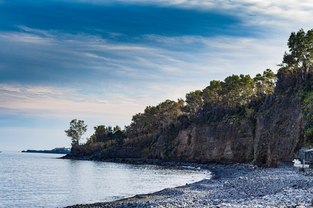 Praiola beach in Riposto. Characteristic of the beach with large pebbles of lava stone and the characteristic coastal profile called "chiancone"