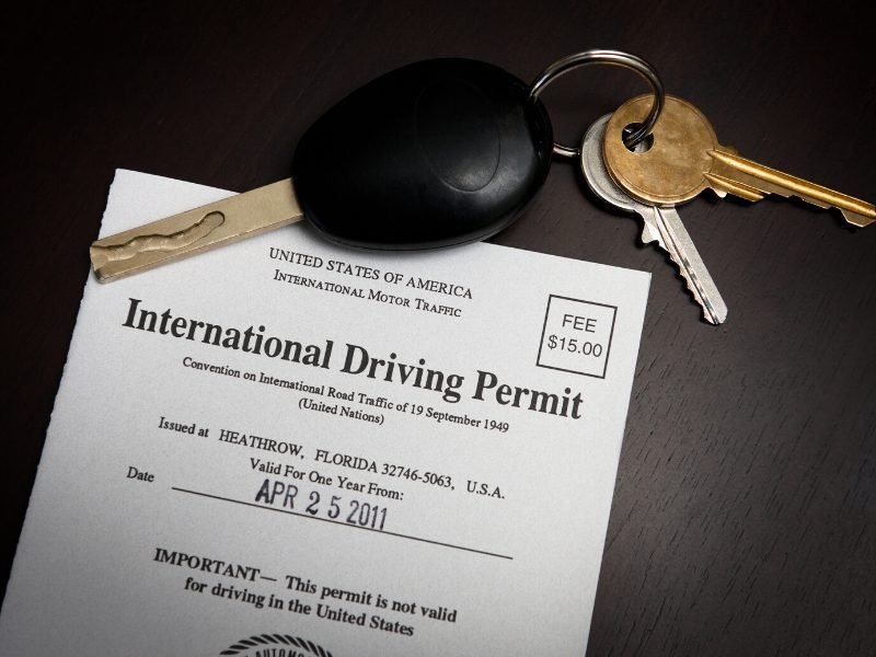 An international driving permit and car keys