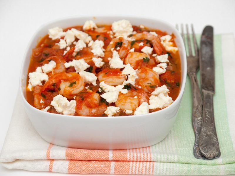 Shrimp saganaki - shrimp in tomato sauce with feta and herbs