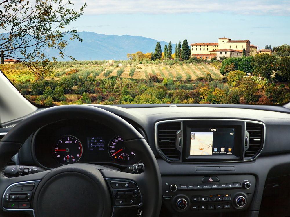 View of a road in Tuscany overlooking a vineyard