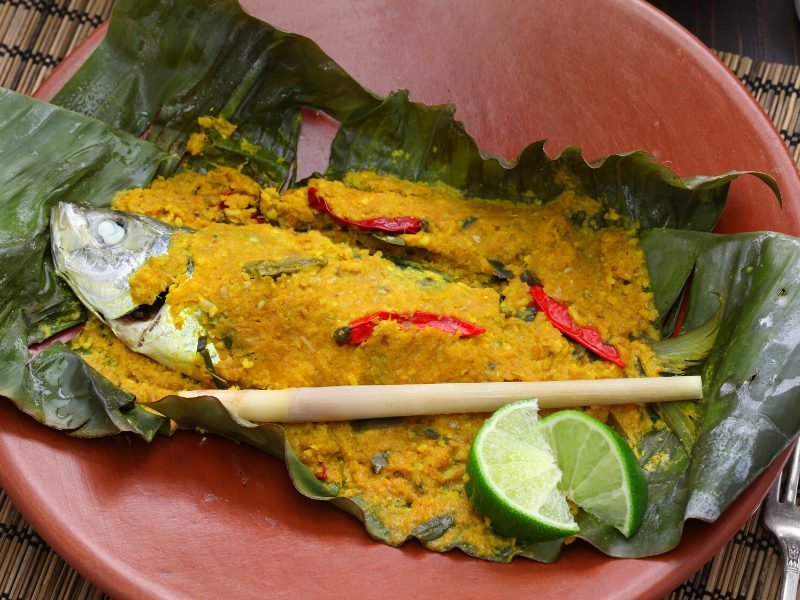 Pepes Ikan, a traditional fish dish in Bali made with a turmeric chili paste and steamed in a banana leaf