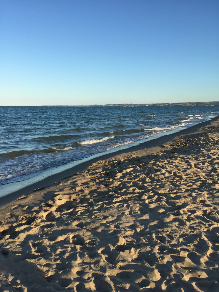 Vaccarizzo beach with sandy shores and calm water lapping at the shore