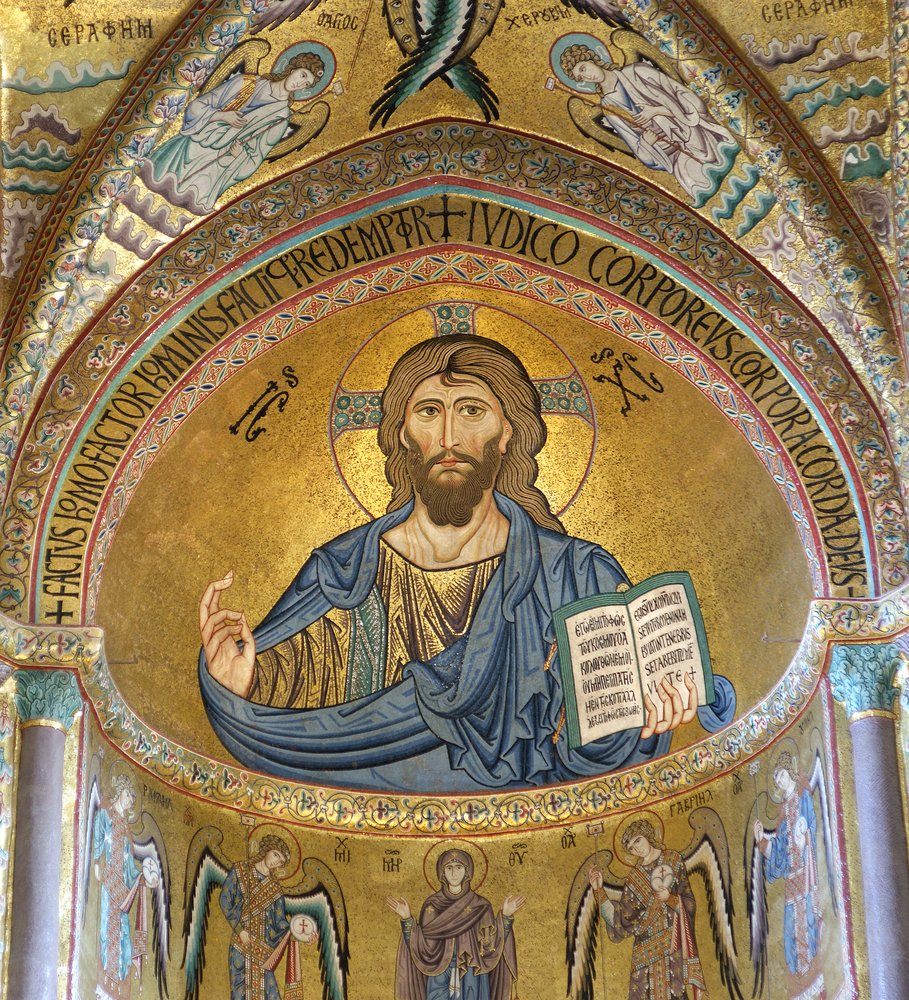 The Christ Pantokrator in the Cathedral-Basilica of Cefalu, now a Roman Catholic church. Gold mosaic and lots of detailing, Jesus holding a book and angels below him.