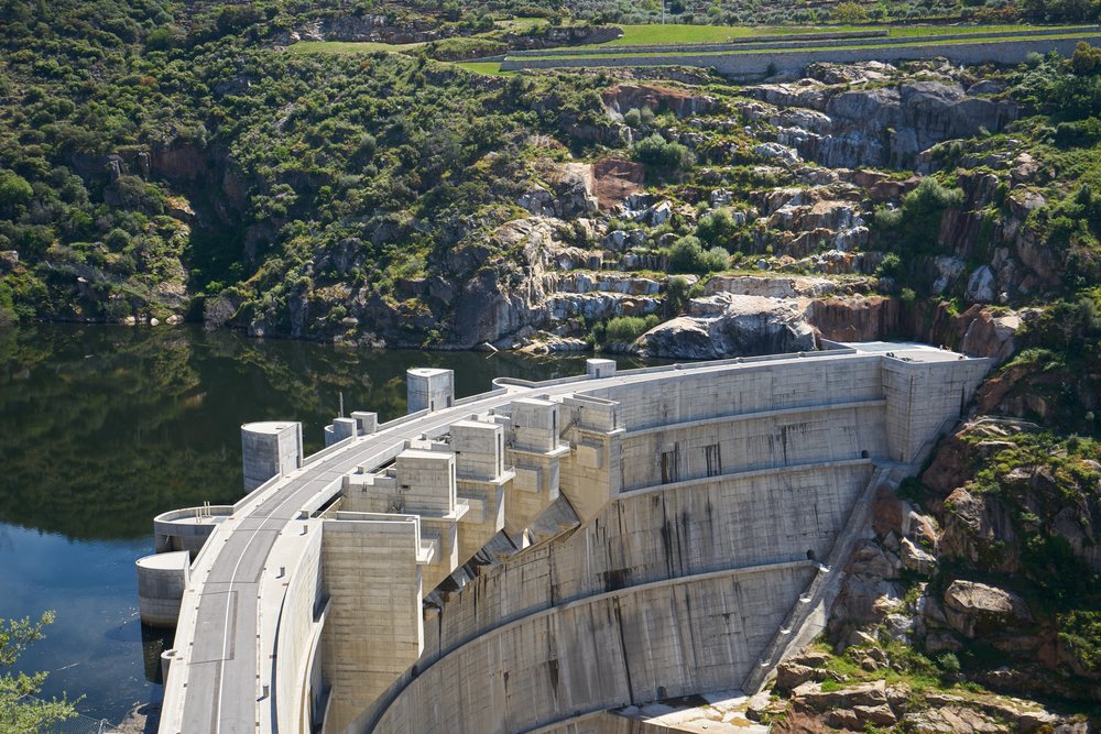 view of the foz Tua dam which separates the river in Portugal's Douro Valley
