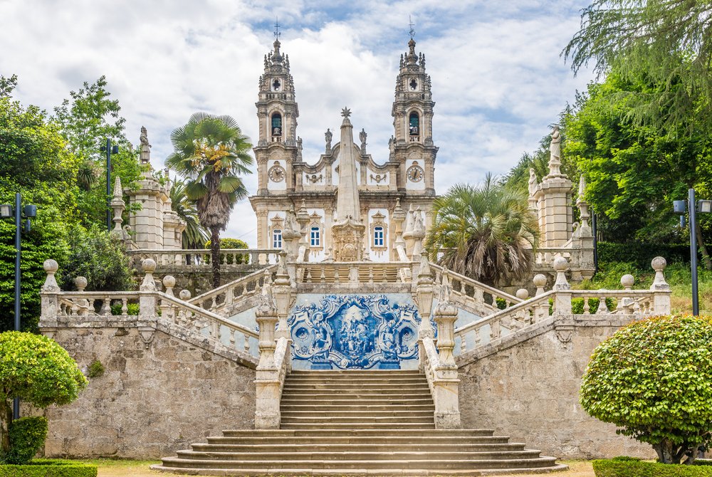 staircase with azulejo tilework leading up to the famous church at the top of the steps in lamego, portugal