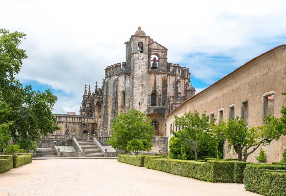 The convent of christ building in tomar portugal with stone work and bells