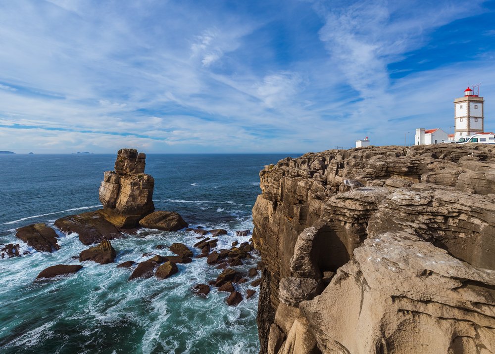 Lighthouse in Peniche on the coast of Portugal with the wild atlantic ocean on the other side