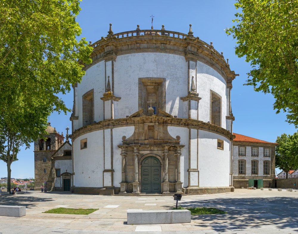 a round church surrounded by trees in porto's monastery on vila nova de gaia side of the douro river