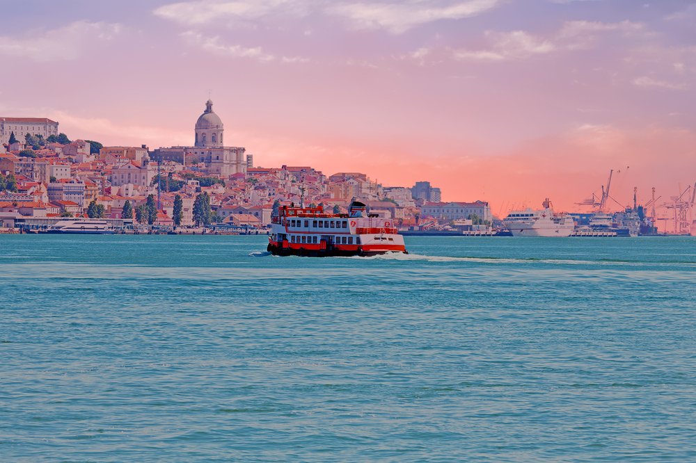 Ferry cruising on the river Tejo near Lisbon Portugal at sunset