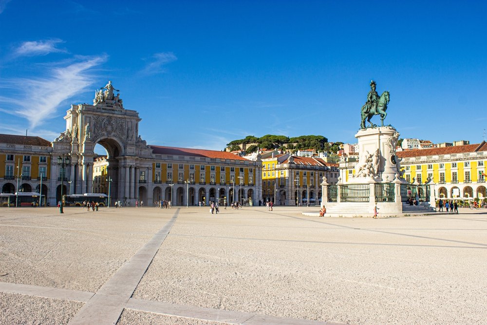 View of an empty Praça do Comércio and Arco da Rua Augusta on a sunny day in Lisbon